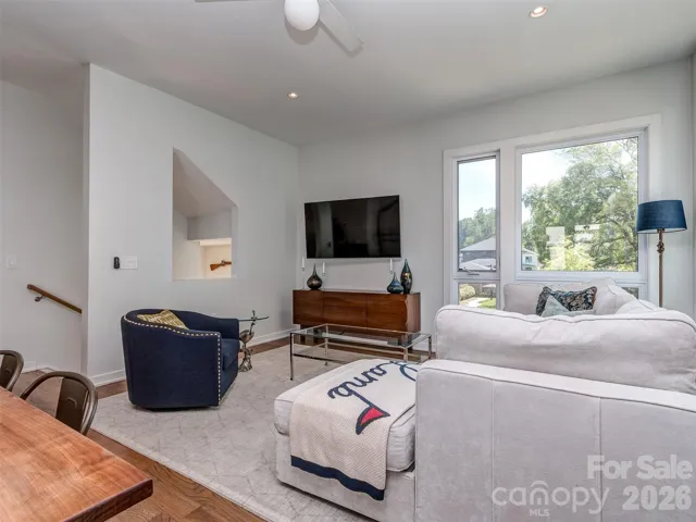 The Open Great Room is on the Main Floor with New Hardwood Floors, Tons of Natural Light, Recessed & Fan Lighting.