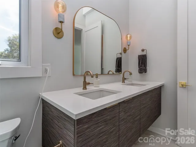 Primary Bath with Floating Dual Quartz Vanity, Tile Flooring, & Custom Walk-in Shower