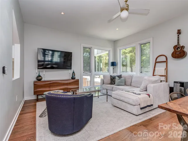 The Open Great Room is on the Main Floor with New Hardwood Floors, Tons of Natural Light, Recessed & Fan Lighting.