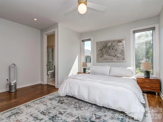 The Primary Corner Bedroom, Hardwood Floors, & Automatic  Black Out Blinds!