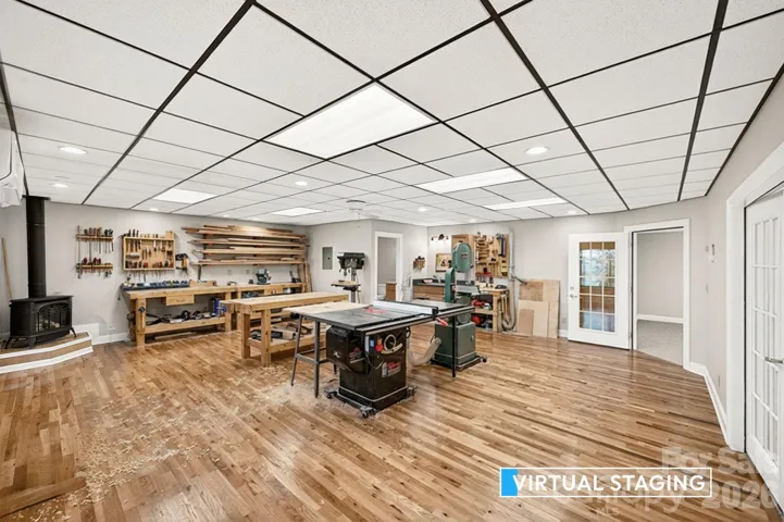 Lowest level flex room could be workshop which is what the current onwer used it for or game room. 