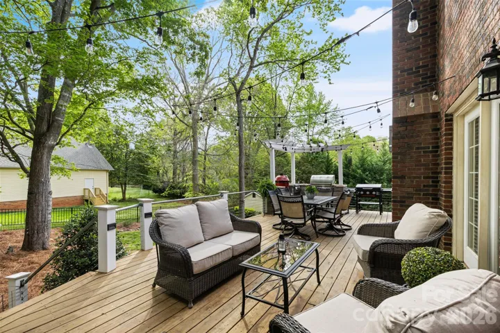 Deck spans rear of home with access from breakfast room, laundry & living room.