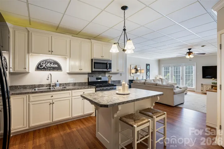 Second kitchen in second living quarters in basement.  Gas range & oven, island & pantry space.