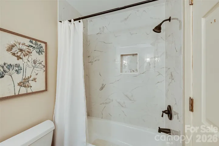 Tub/shower combo with full tile.