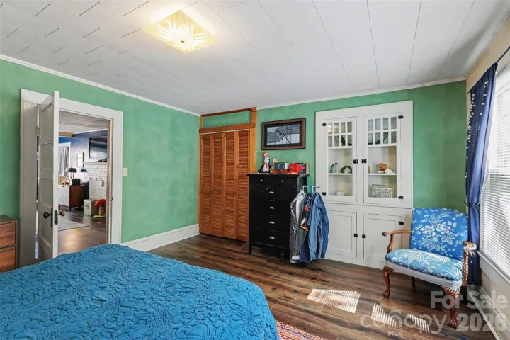 Primary Bedroom with cabinet/shelving built-ins