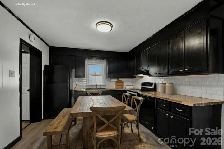 Virtually staged kitchen with butcher block counters