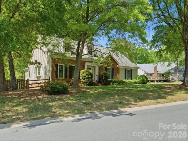 Beautiful mature trees decorate this neighborhood and this lot!