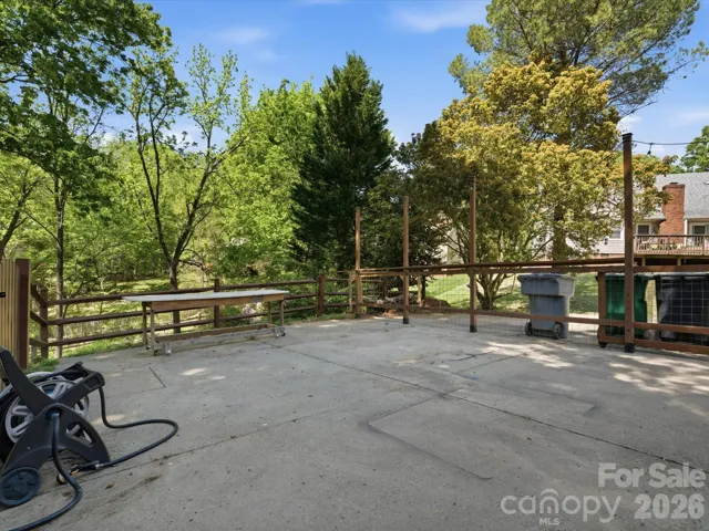 Large parking area of driveway for Cornhole, fire pit, or dog play area 