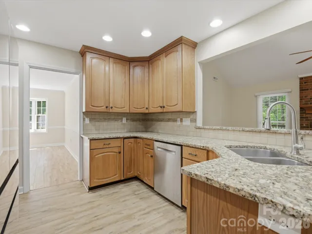 Tall cabinets, granite countertops, open kitchen for entertaining 