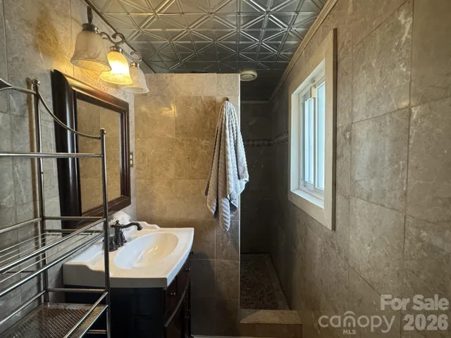 Full bath at rear of home