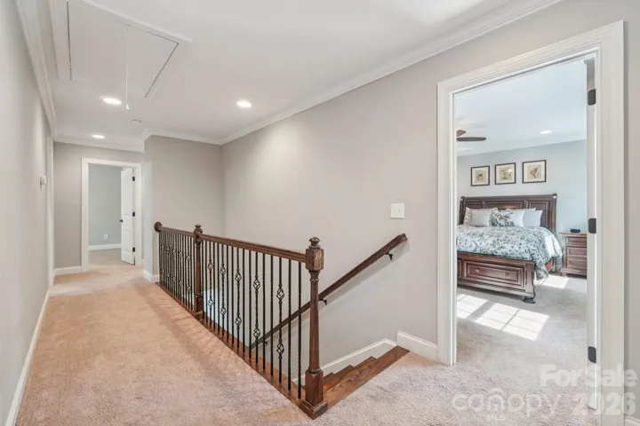 Landing at top of stairs and pull down ladder to attic.