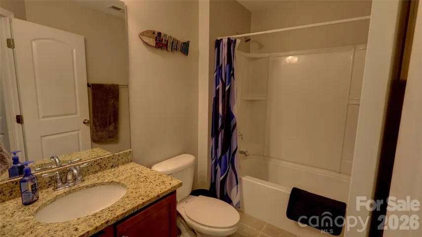One of three full bathrooms upstairs