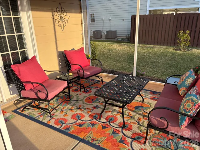 Relax and unwind in the screened-in porch or enjoy outdoor living on the cobblestone back patio, creating the perfect blend of comfort and charm.