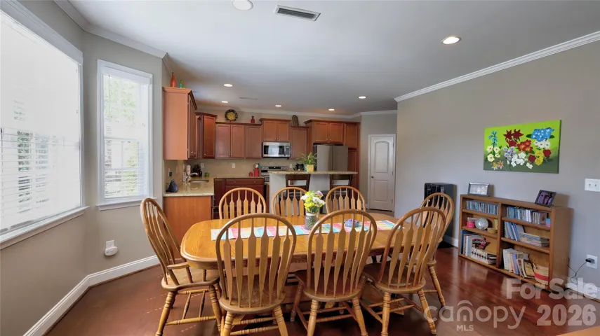 Expansive kitchen with many cabinets, walk in pantry and counter tops open to kitchen and great room.