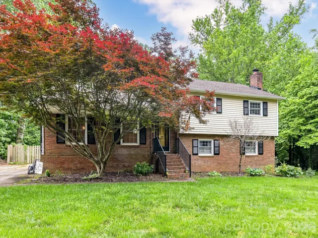 Beautifully updated split-level 4-bedroom, 3 full bathroom home in Mooresville located in a desirable Lake Norman neighborhood, featuring a spacious, private backyard perfect for outdoor living and entertaining.
