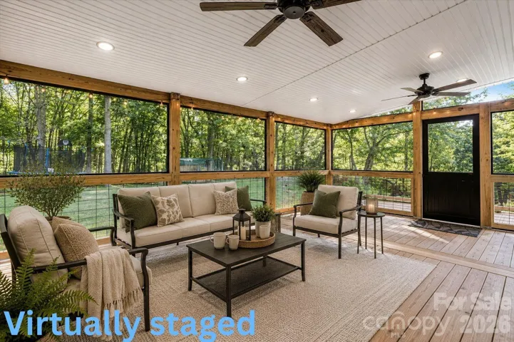 The screened porch creates the perfect year-round outdoor retreat, offering a peaceful place to enjoy morning coffee, unwind after a long day, or entertain while overlooking the private wooded backyard.