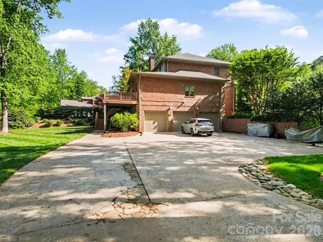 The second driveway leads to the three car garage and is a great spot for parties and family gatherings.