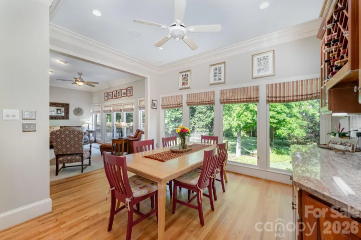 The huge windows continue into the sunroom with access to the back deck.