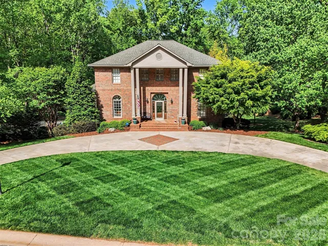 A circle drive in front of the home is one of two driveways...