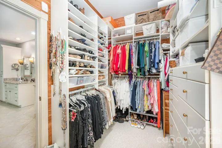 There are TWO separate custom designed closets from California Closets off the primary bathroom.