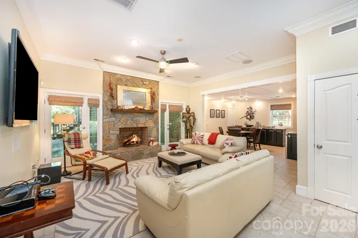 Family room in the basement with fireplace and access to a covered patio/back yard