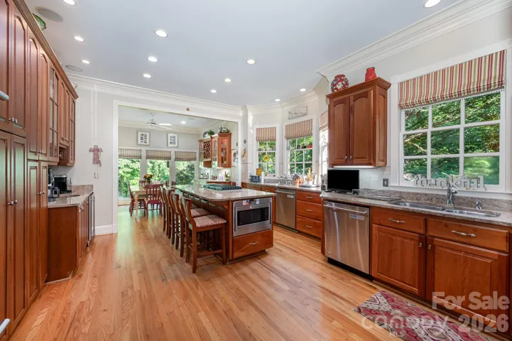 This CHEF'S KITCHEN has 3 sinks, two dishwashers,...