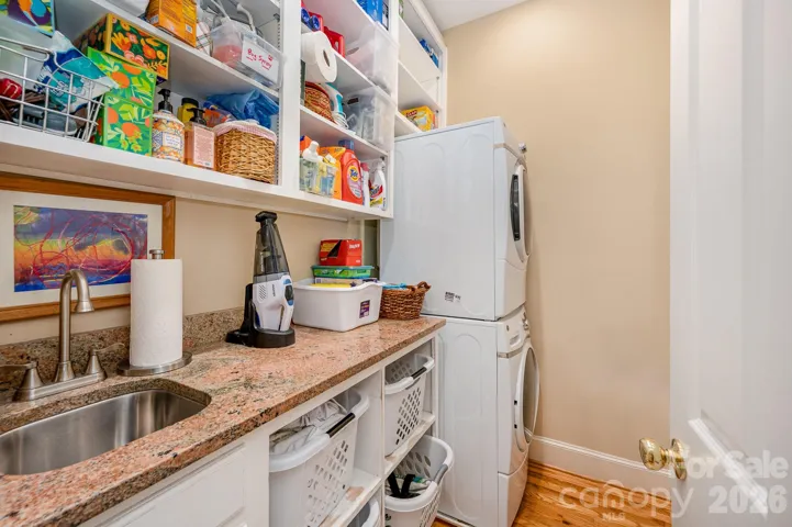 The laundry room on the main floor offers plenty of counterspace and storage.