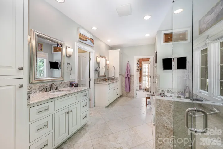 Look at this gorgeous primary bath! Two vanities, separate tub/shower and plenty of storage!