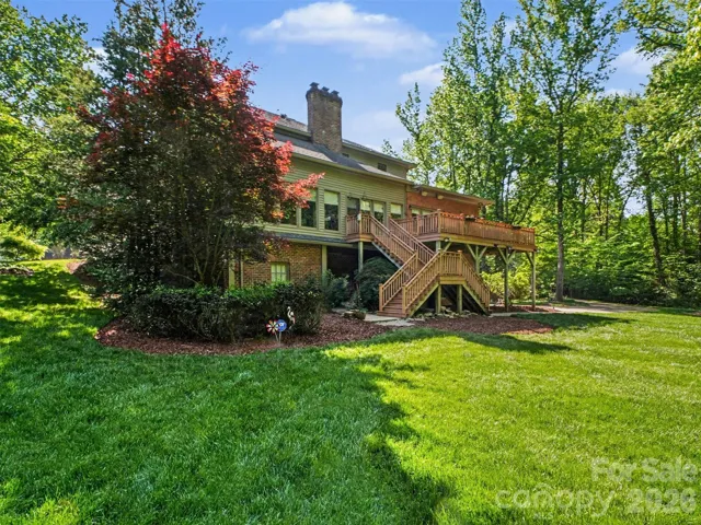 Stairs from the deck lead to the back yard for easy access.
