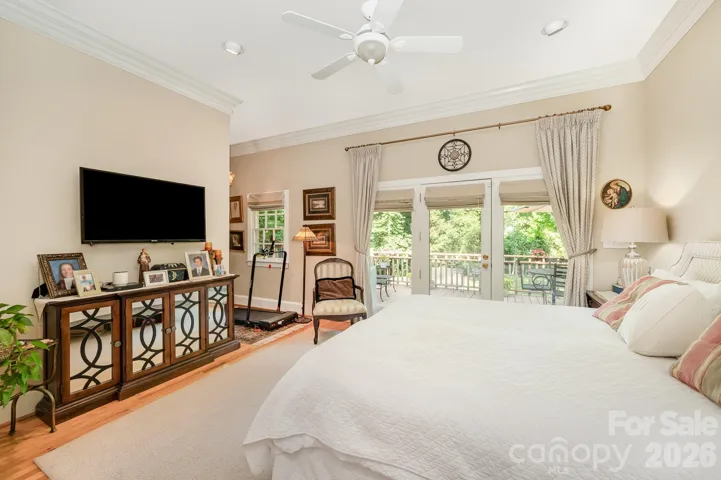 The large primary bedroom is bright and also has access to the back deck.