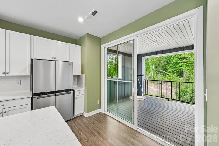 Extra large sliding door opens to covered outdoor Balcony