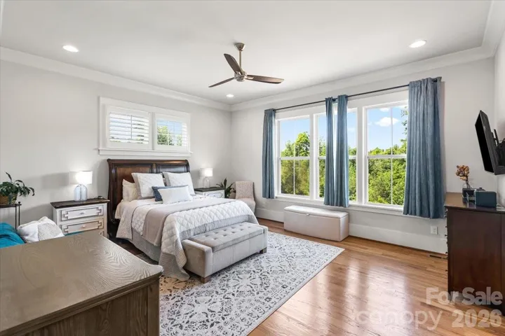 The main-level primary suite... your private retreat, yet just steps from the heart of the home