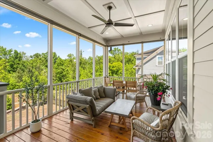 The tranquil screen porch, with privacy shades when you want them... your year-round retreat.