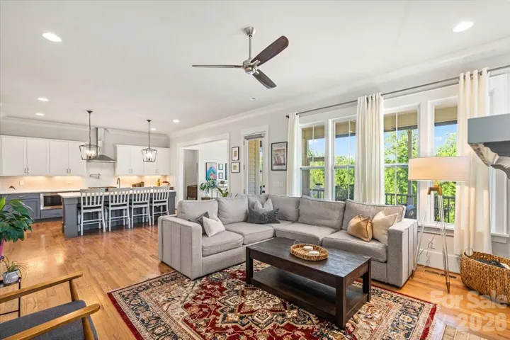 Open-concept living, kitchen, and dining at the back of the home... the heart of every gathering.