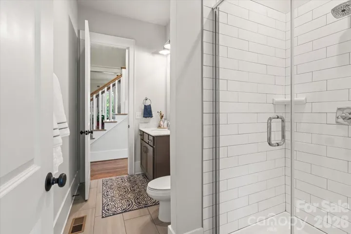 Beautiful and spacious main level full bathroom with a shower, off the 2nd bedroom and available for visitors. 