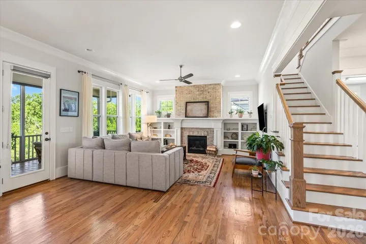 Gas fireplace, custom built-ins, and transom windows... the great room stops you in your tracks.