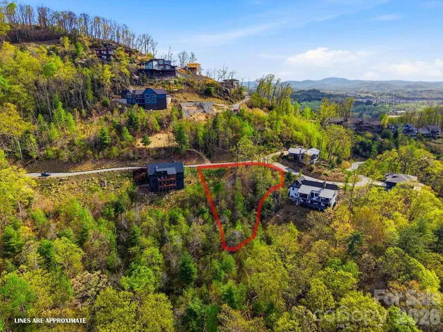 Positioned within the gated mountain community of The Boulders, 325 Curtain Bluff (lot W9) offers a rare opportunity to capture stunning long-range mountain views with unforgettable sunset exposures.