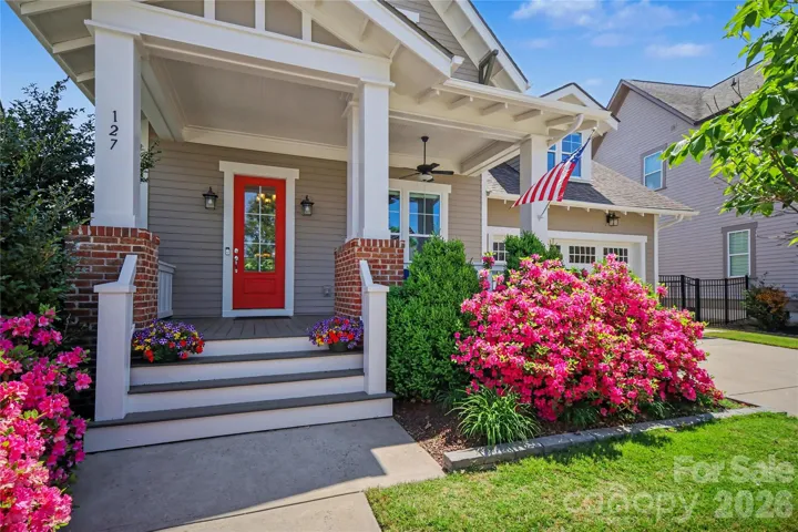 Stunning home with fresh exterior paint and beautiful landscaping—a perfect blend of style and curb appeal!