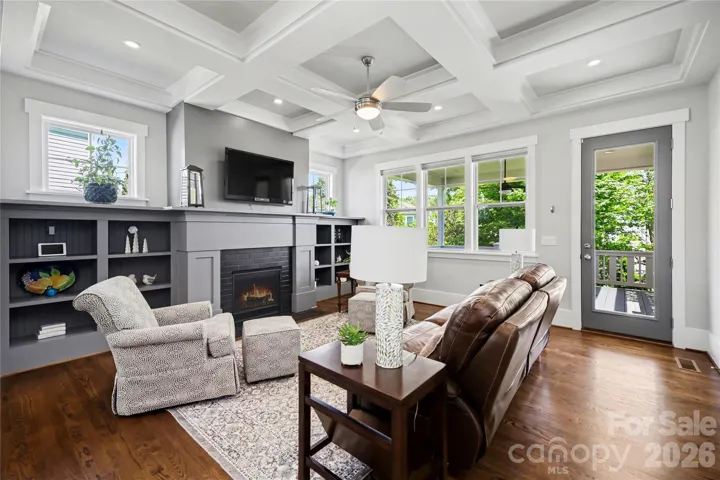 Custom craftsman fireplace surround an bookshelves in the living room