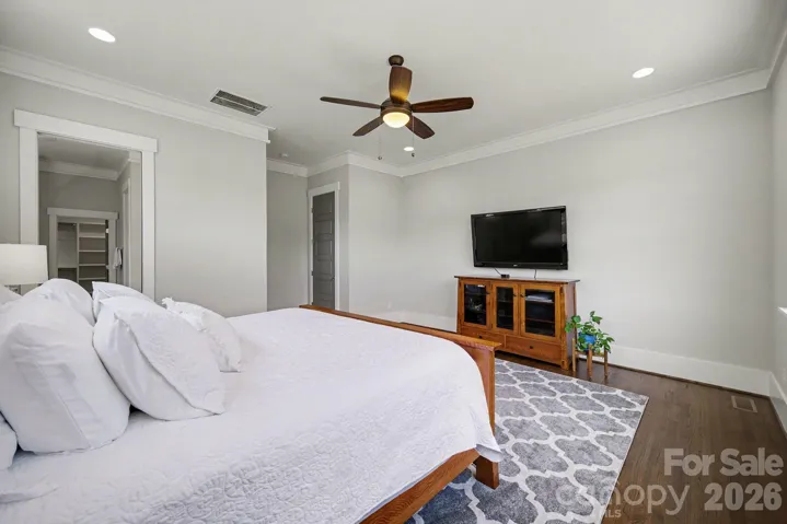 Oversized primary suite features an ensuite bathroom and large walk-in closet