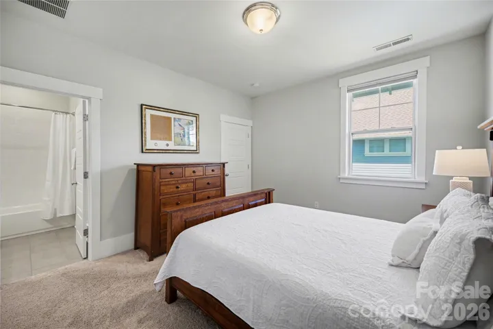 Ensuite bathroom features tile floors