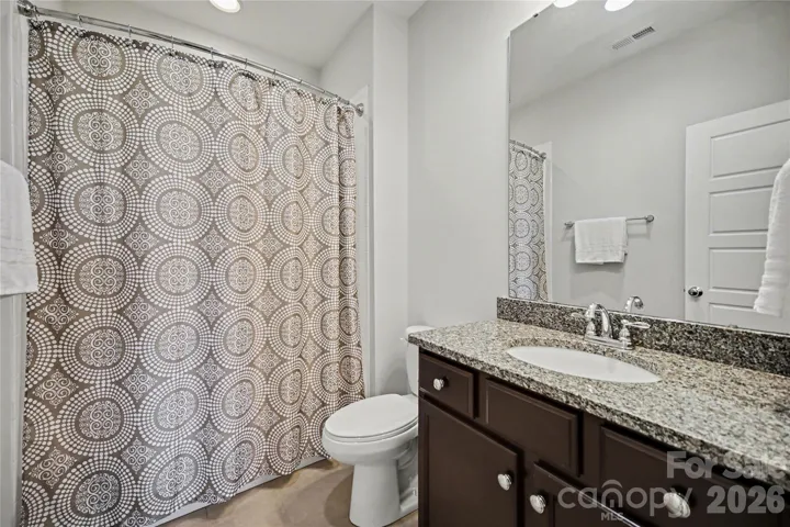 Bathroom #3 has granite countertops, tub/shower combo and tile floors