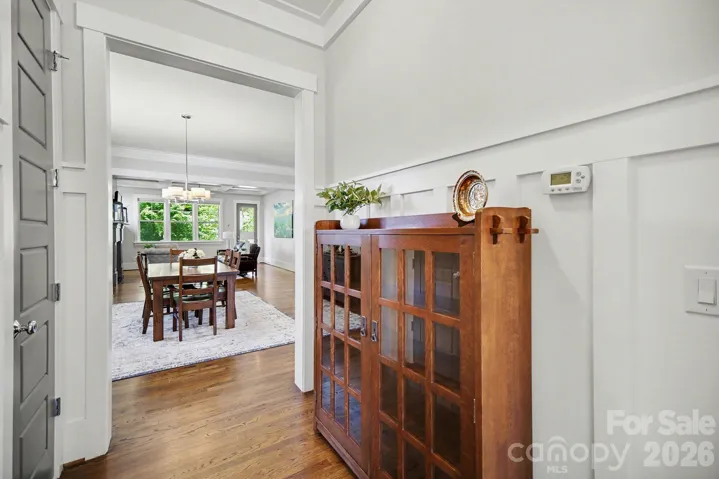 10 ft ceilings, 8 ft doors, hardwood floors and extensive trim work throughout the main level...including the foyer!