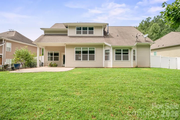 Rear Covered Porch and Large Decorative Stamped Concrete Patio.