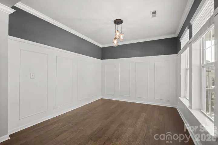 Dining Room with elevated wainscoting and trim work.