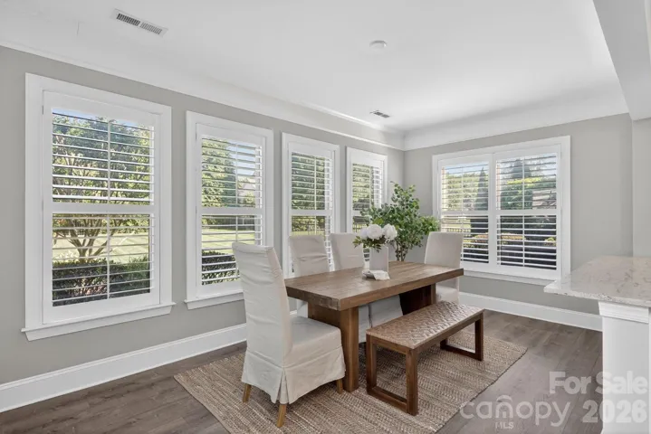 Large, sunny breakfast area leading to backyard