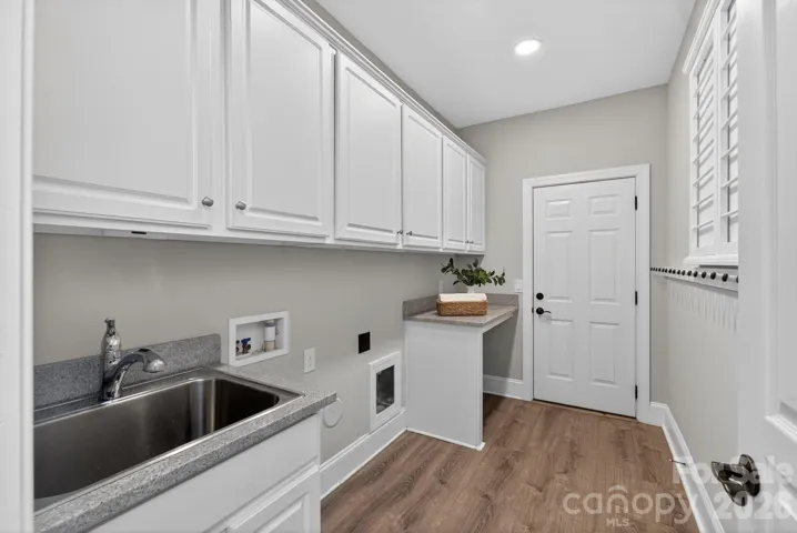 Large laundry leading to garage