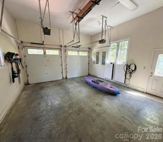 Great side lost Greg with 2 built in Tesla chargers. Home also has new Solar Power roof cells which will run the house on back up power.  