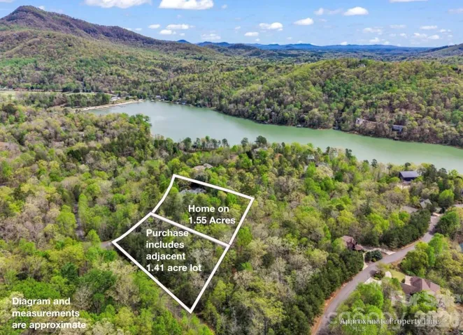 This home and the adjacent lot are included in the asking price shown. Extra lot is buildable and a separate parcel. 