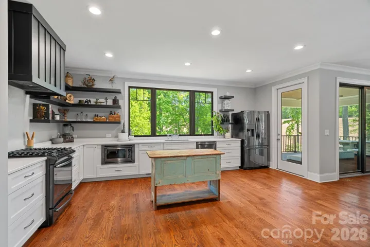 Quartz countertops, soft-close cabinets with pull-out drawers. 